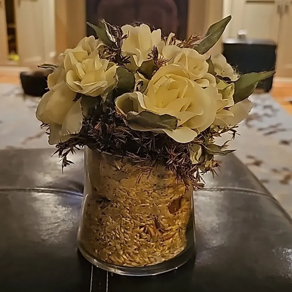 Floral Arrangement with White Roses and Leaves in Glass Vase